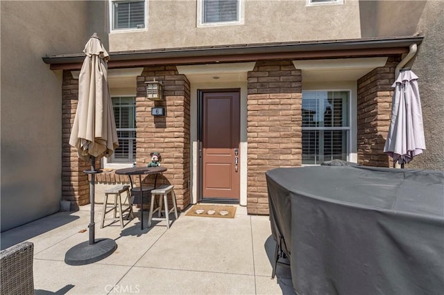 6 Fenix St, Rancho Mission Viejo, CA 92694 - property entrance featuring stucco siding, a jacuzzi, and stone siding