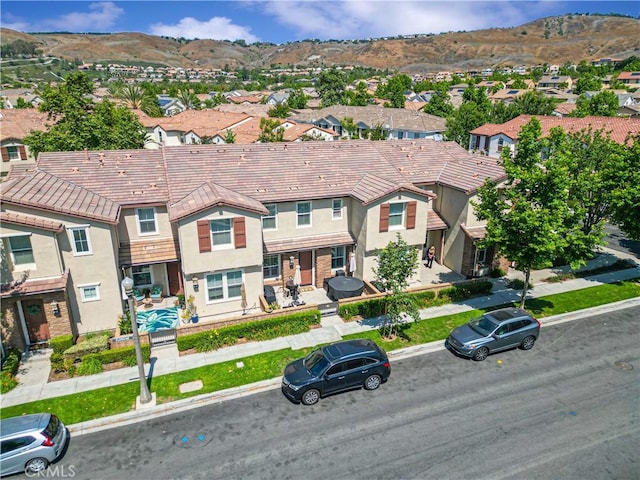 6 Fenix St, Rancho Mission Viejo, CA 92694 - view of front of home with a residential view, stucco siding, a mountain view, and a tile roof