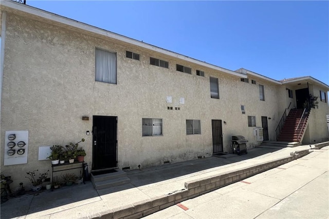 1431 S Gaffey St, San Pedro, CA 90731 - back of house with stucco siding and stairs