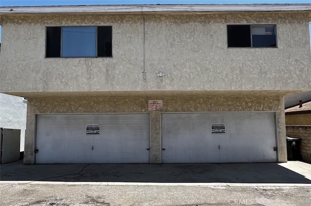 1431 S Gaffey St, San Pedro, CA 90731 - back of house featuring an attached garage and stucco siding