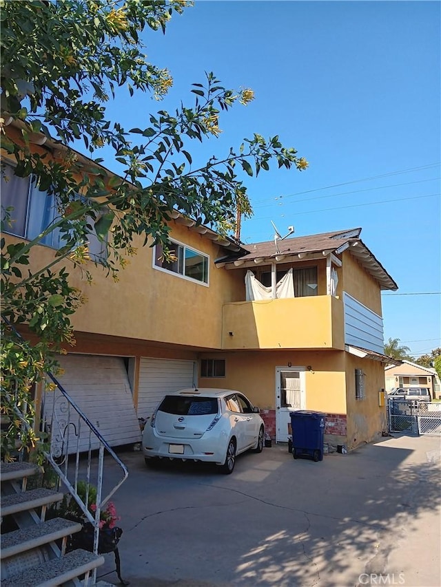 10007 Otis St, South Gate, CA 90280 - view of property featuring a garage and concrete driveway