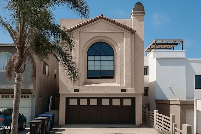 381 Highland Dr, Oxnard, CA 93035 - view of front of property with stucco siding, a garage, driveway, and a chimney