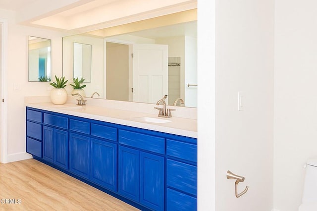 381 Highland Dr, Oxnard, CA 93035 - bathroom featuring double vanity and wood finished floors