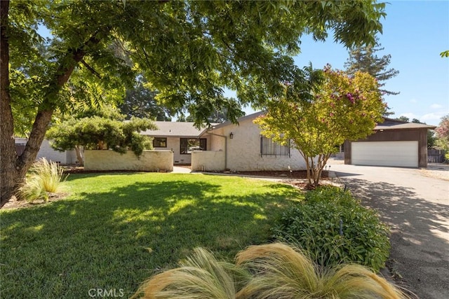 667 Morgan Dr, Chico, CA 95973 - view of front of home with a front yard, stucco siding, driveway, and a garage