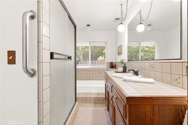 667 Morgan Dr, Chico, CA 95973 - full bath with vanity, a shower stall, a bath, and tile patterned floors
