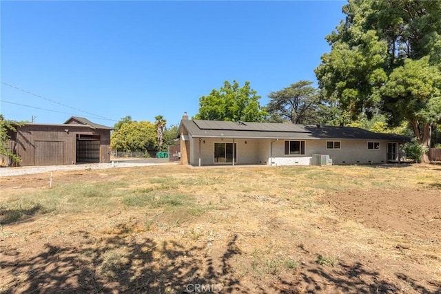 667 Morgan Dr, Chico, CA 95973 - back of property with solar panels, a chimney, and a patio area