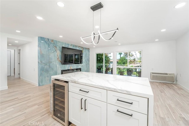 2143 Ronda Granada Unit P, Laguna Woods, CA 92637 - kitchen featuring wine cooler, a wall unit AC, open floor plan, recessed lighting, and light wood-style flooring