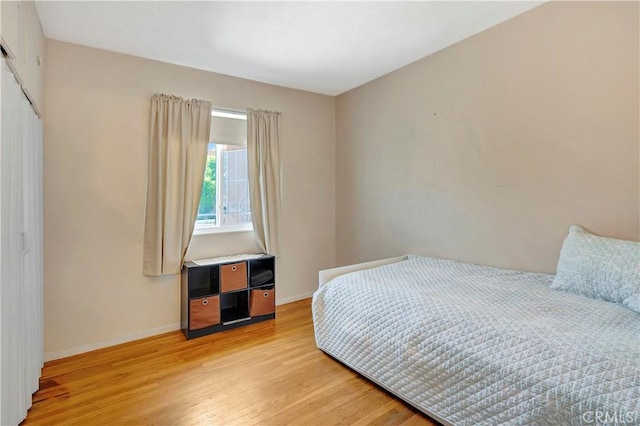 15041 Columbia Ln, Huntington Beach, CA 92647 - bedroom with light wood-style flooring and a closet