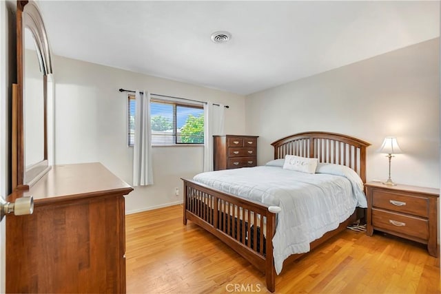 15041 Columbia Ln, Huntington Beach, CA 92647 - bedroom with light wood-style flooring and baseboards