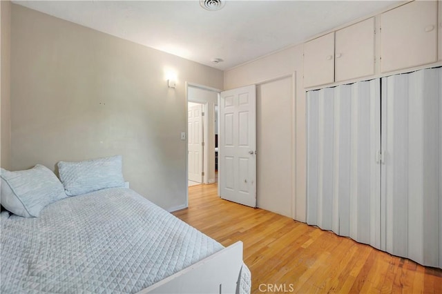 15041 Columbia Ln, Huntington Beach, CA 92647 - bedroom with light wood-style flooring