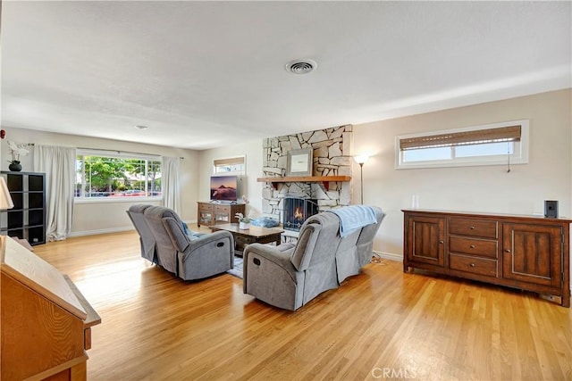 15041 Columbia Ln, Huntington Beach, CA 92647 - living room featuring light wood finished floors and a fireplace