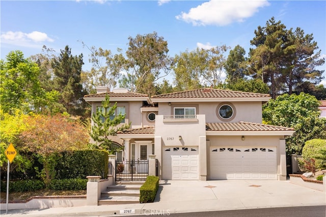 2767 Saleroso Dr, Rowland Heights, CA 91748 - mediterranean / spanish house featuring a balcony, driveway, stucco siding, and a tiled roof