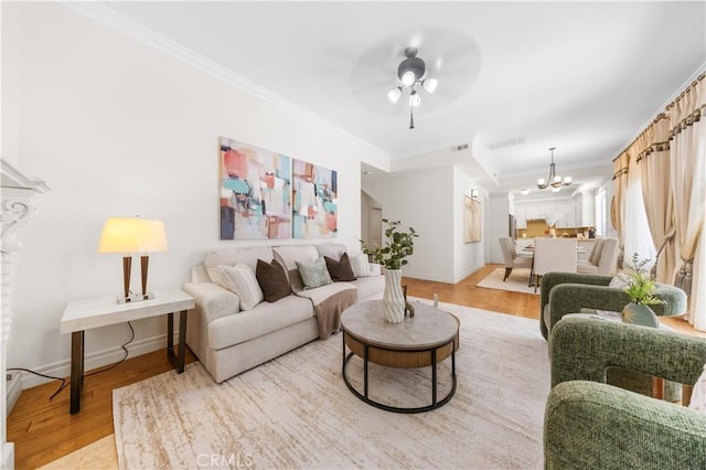 2767 Saleroso Dr, Rowland Heights, CA 91748 - living room featuring light wood finished floors, ceiling fan, crown molding, and a chandelier