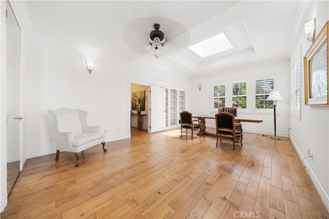2767 Saleroso Dr, Rowland Heights, CA 91748 - sitting room featuring a skylight, a tray ceiling, light wood-style flooring, a ceiling fan, and ornamental molding