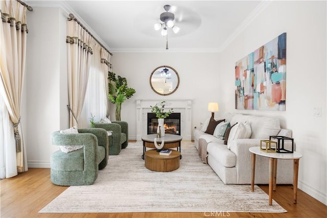 2767 Saleroso Dr, Rowland Heights, CA 91748 - living room featuring ornamental molding, a glass covered fireplace, wood finished floors, and a ceiling fan