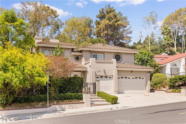 2767 Saleroso Dr, Rowland Heights, CA 91748 - mediterranean / spanish home with a balcony, stucco siding, concrete driveway, and an attached garage