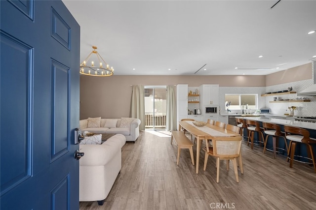 2920 Fairmount Ave, La Crescenta, CA 91214 - living area featuring wood finished floors, a chandelier, and recessed lighting