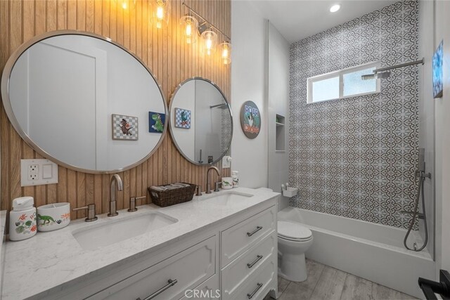 2920 Fairmount Ave, La Crescenta, CA 91214 - full bathroom featuring double vanity, shower / tub combination, and wood finished floors