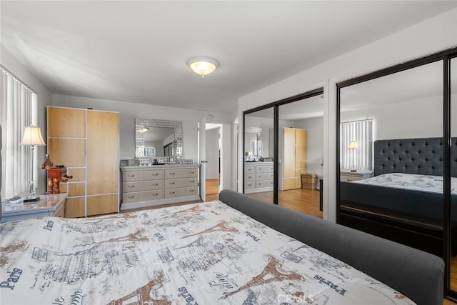 2920 Fairmount Ave, La Crescenta, CA 91214 - bedroom with multiple closets and wood finished floors