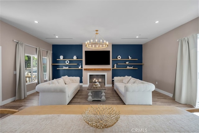 2920 Fairmount Ave, La Crescenta, CA 91214 - living area with a chandelier, wood finished floors, recessed lighting, and a warm lit fireplace