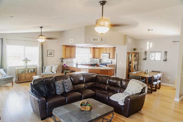 14330 Jennings Vista Way, Lakeside, CA 92040 - living room featuring a ceiling fan, vaulted ceiling, light wood-type flooring, and plenty of natural light