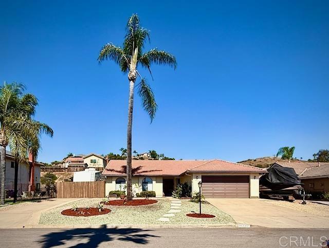 14330 Jennings Vista Way, Lakeside, CA 92040 - single story home with a garage, driveway, and stucco siding