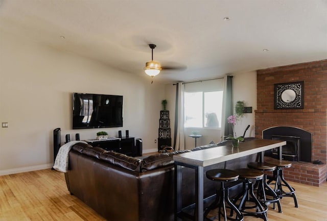 14330 Jennings Vista Way, Lakeside, CA 92040 - living area featuring light wood-style flooring, a fireplace, and a ceiling fan