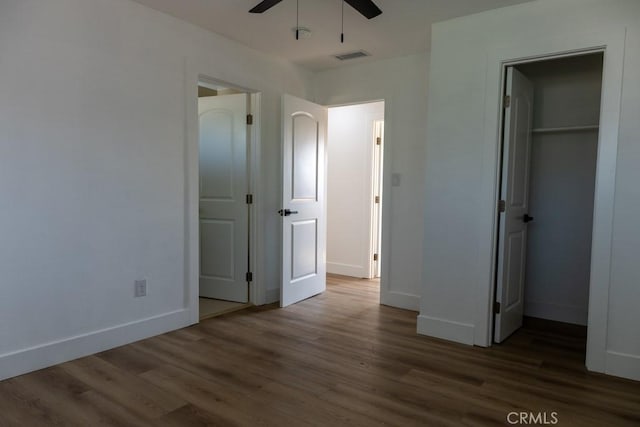 8666 Calaveras Ave, Rancho Cucamonga, CA 91730 - unfurnished bedroom with dark wood-style flooring, a walk in closet, a closet, and ceiling fan