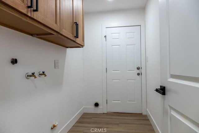 8666 Calaveras Ave, Rancho Cucamonga, CA 91730 - laundry area featuring cabinet space, light wood finished floors, and hookup for a gas dryer