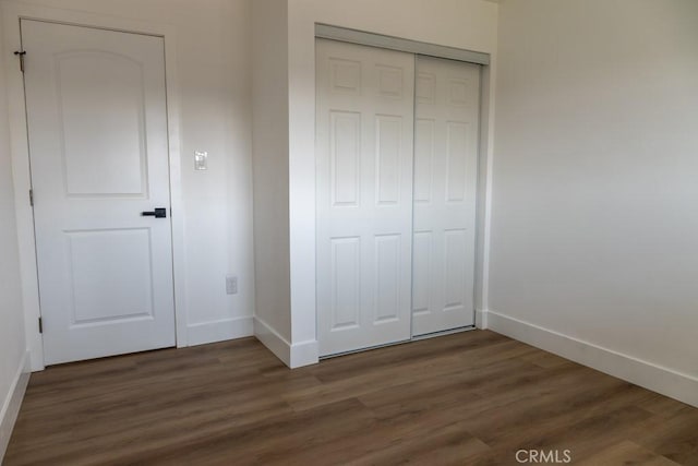 8666 Calaveras Ave, Rancho Cucamonga, CA 91730 - unfurnished bedroom featuring dark wood-style floors and a closet