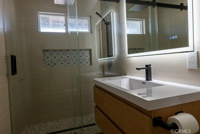 8666 Calaveras Ave, Rancho Cucamonga, CA 91730 - full bath featuring healthy amount of natural light, vanity, a stall shower, and tile walls