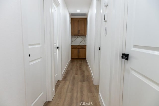 8666 Calaveras Ave, Rancho Cucamonga, CA 91730 - hall with light wood-style floors and recessed lighting