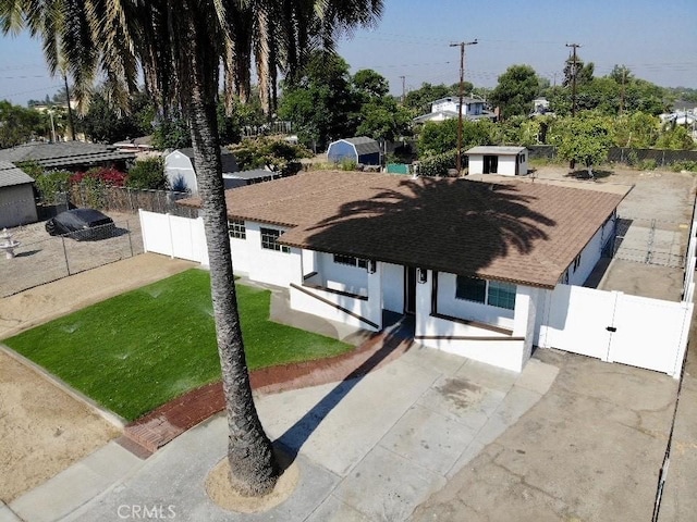 8666 Calaveras Ave, Rancho Cucamonga, CA 91730 - view of front facade with stucco siding, a gate, roof with shingles, and driveway