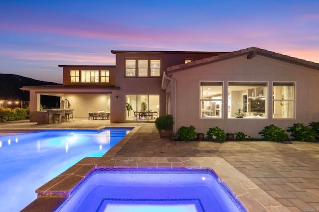 2990Eldenberry St, Escondido, CA 92029 - back of house at dusk featuring a patio area, an outdoor pool, and stucco siding
