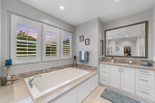 2990Eldenberry St, Escondido, CA 92029 - bathroom with vanity, a bath, backsplash, tile patterned flooring, and recessed lighting