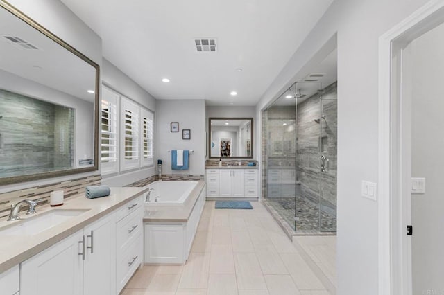 2990Eldenberry St, Escondido, CA 92029 - bathroom with a stall shower, two vanities, a garden tub, recessed lighting, and tasteful backsplash