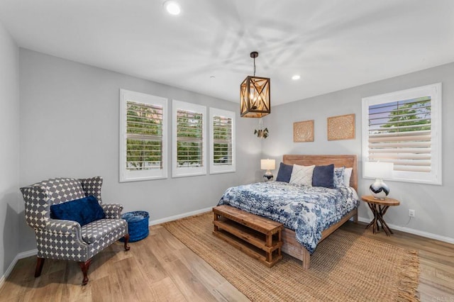 2990Eldenberry St, Escondido, CA 92029 - bedroom featuring a chandelier, wood finished floors, multiple windows, and recessed lighting