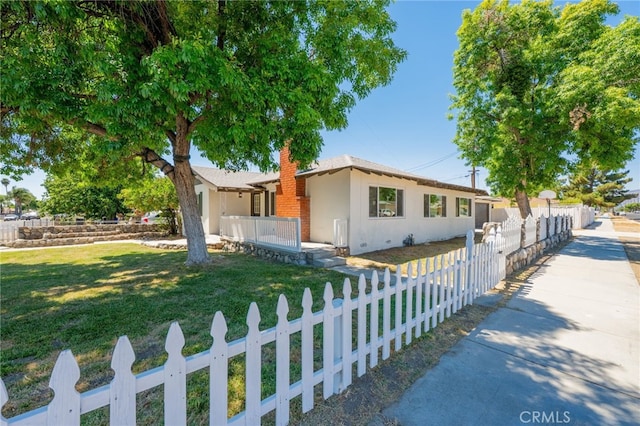 880 E Wright St, Hemet, CA 92543 - ranch-style house featuring a fenced front yard, a chimney, and stucco siding