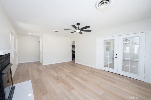 880 E Wright St, Hemet, CA 92543 - unfurnished living room featuring light wood-type flooring, a ceiling fan, and french doors