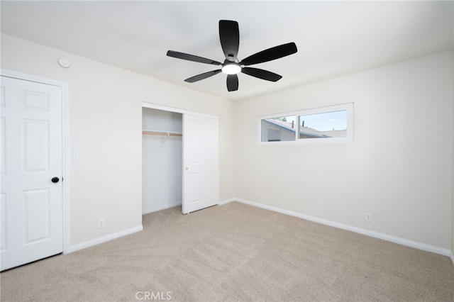 880 E Wright St, Hemet, CA 92543 - unfurnished bedroom featuring light colored carpet, a closet, and a ceiling fan