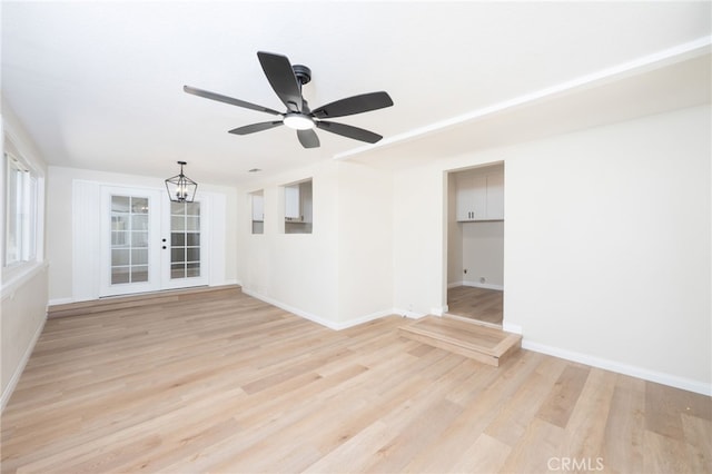 880 E Wright St, Hemet, CA 92543 - unfurnished room with light wood-style floors, a ceiling fan, and a chandelier