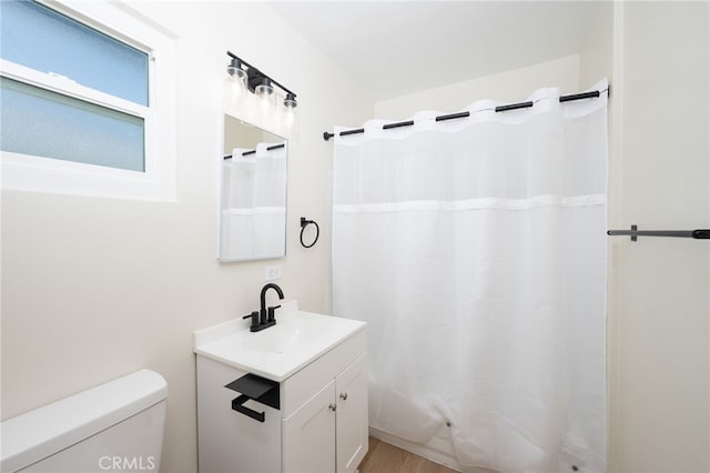 880 E Wright St, Hemet, CA 92543 - full bathroom with vanity, wood finished floors, and a shower with shower curtain