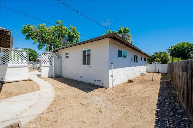 880 E Wright St, Hemet, CA 92543 - view of property exterior featuring stucco siding, a fenced backyard, and a patio area