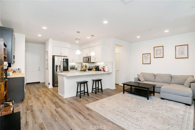101 Red Brick Dr Unit 5, Simi Valley, CA 93065 - living room with light wood-style floors and recessed lighting