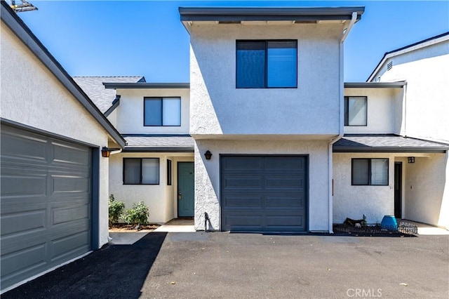 10710 El Camino Real Unit 14, Atascadero, CA 93422 - view of front of house featuring stucco siding, driveway, and an attached garage