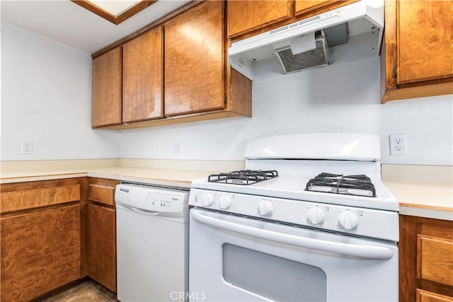 10710 El Camino Real Unit 14, Atascadero, CA 93422 - kitchen featuring white appliances, extractor fan, brown cabinetry, and light countertops