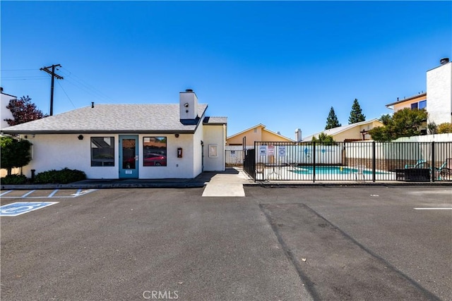 10710 El Camino Real Unit 14, Atascadero, CA 93422 - view of property featuring a community pool and uncovered parking