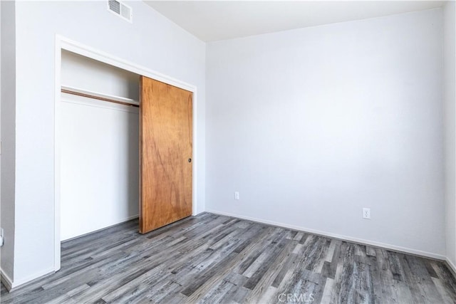 10710 El Camino Real Unit 14, Atascadero, CA 93422 - unfurnished bedroom featuring wood finished floors and a closet