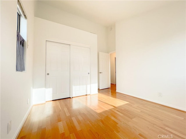 1628 E Palm Ave Unit 5, El Segundo, CA 90245 - unfurnished bedroom featuring light wood-style flooring and a closet