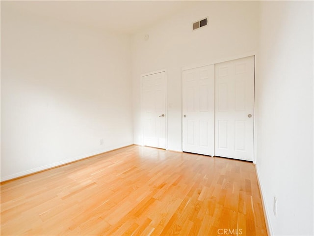 1628 E Palm Ave Unit 5, El Segundo, CA 90245 - unfurnished bedroom featuring light wood-type flooring and a closet